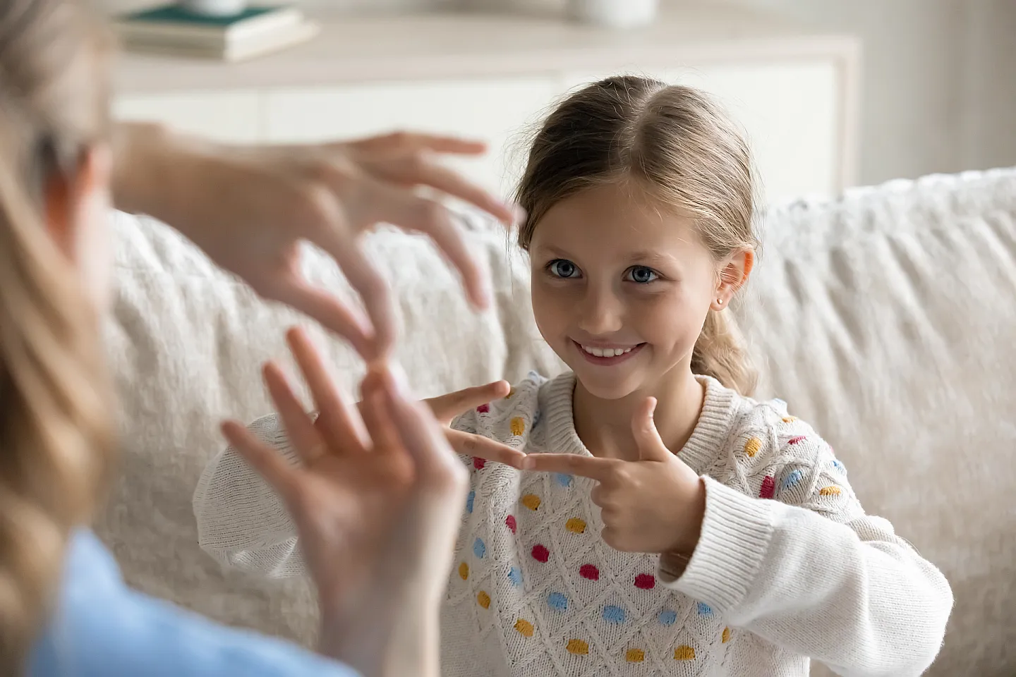 Child using assisted communication device